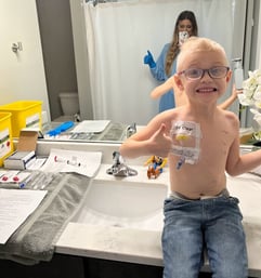 Sage doing at home treatment with his mom