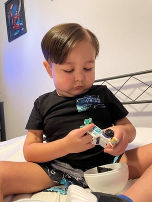 Ayven playing with car in the hospital
