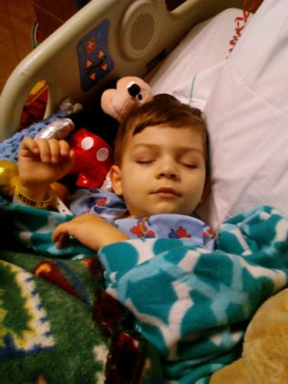 Little River sleeping in the hospital during treatment for leukemia
