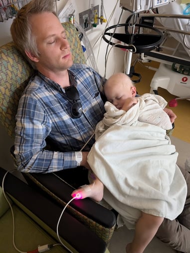 Shepherd and dad hospital sleeping