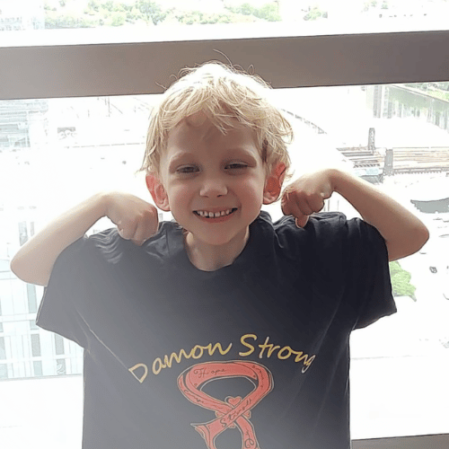 All-Star Damon wearing a Damon Strong shirt while showing his muscles