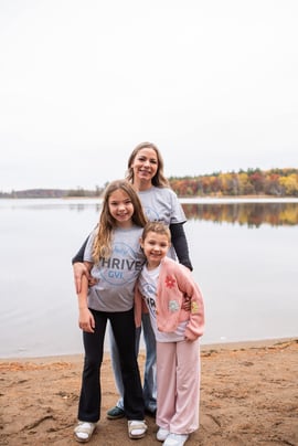 Winnie with mom and sister in Thrive shirts