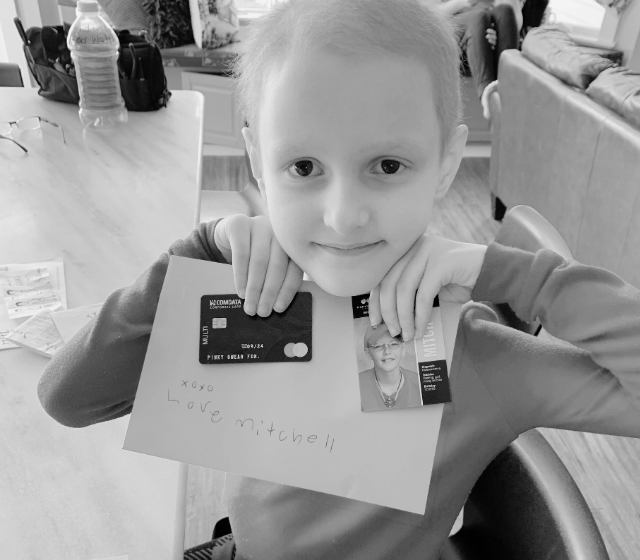 All-Star Anne holding up her Orange Envelope and financial support from Pinky Swear Foundation