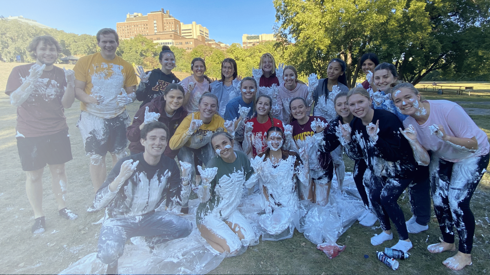A group of Pack college students covered in whipped cream after a Cancer is Messy event to raise money for kids with cancer