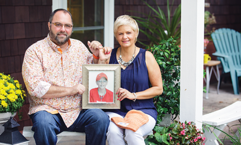 Pinky Swear Foundation founder Mitch Chepokas' parents holding a photo of Mitch.