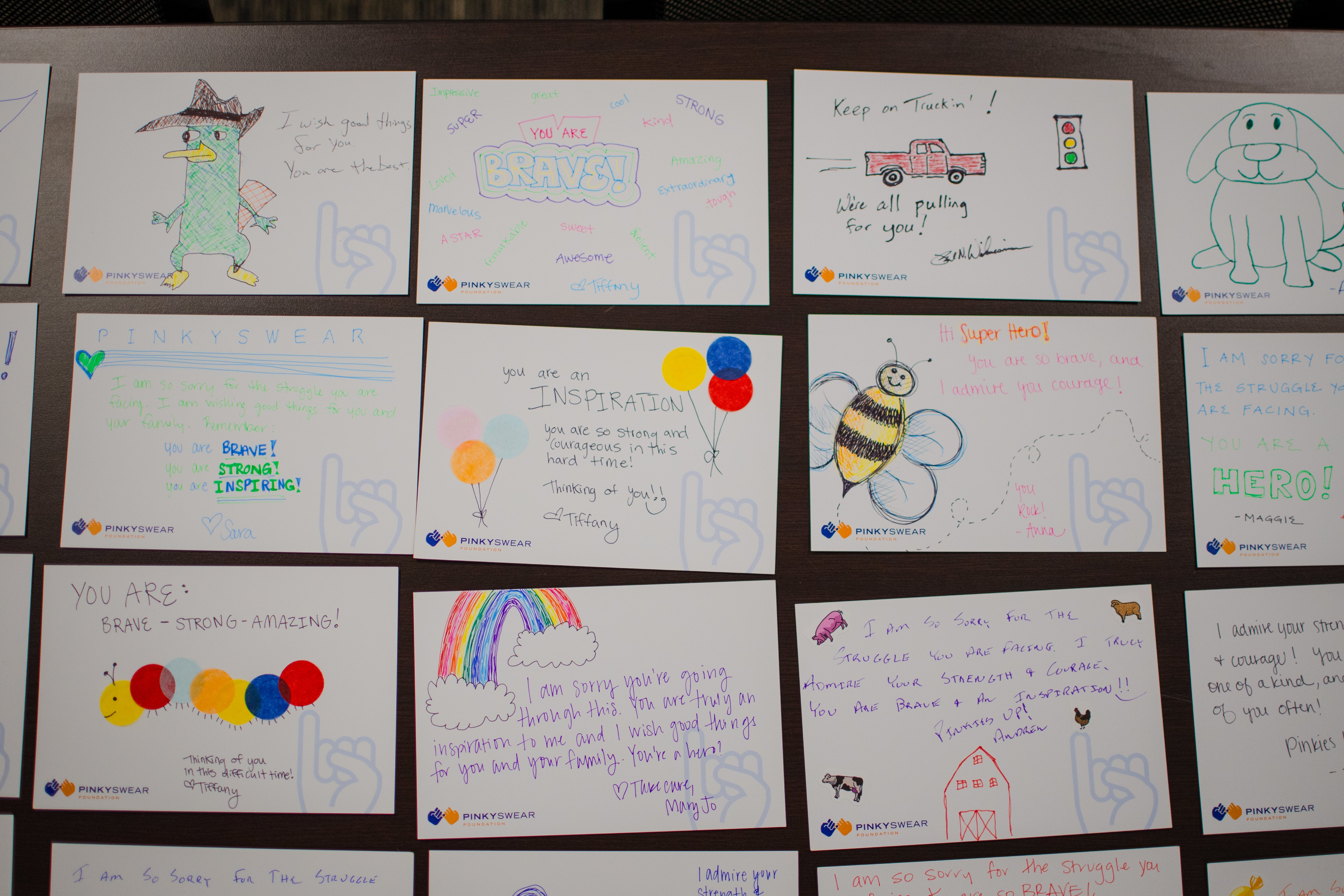 Cards for kids with cancer created by the team at Geneva Capital for Pinky Swear Foundation All-Stars.