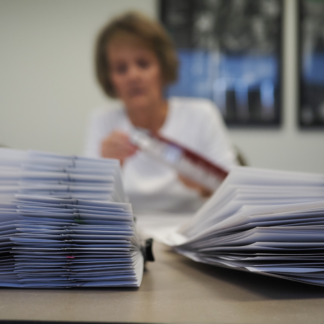 Volunteer Barb helping send out Orange Envelopes