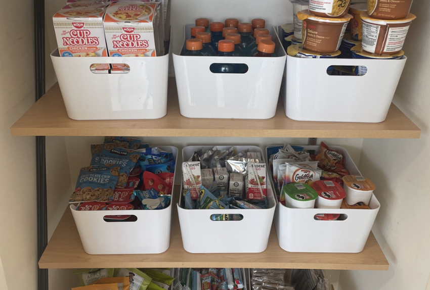 A photo of a Pinky Swear Pantry with food in bins