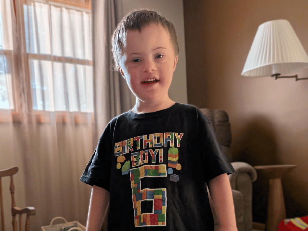 A boy named Isaac on his 6th birthday wearing a 