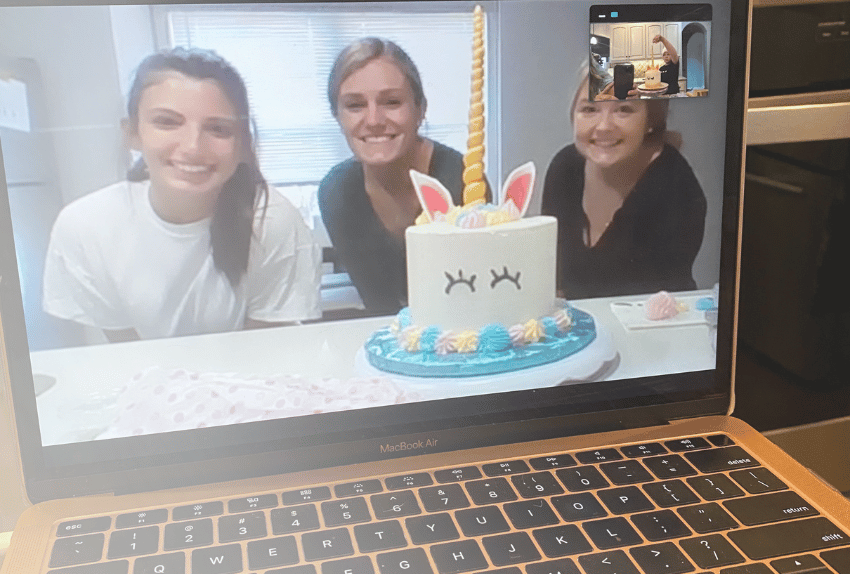 Three college students having a virtual All-Star experience on a laptop baking a cake