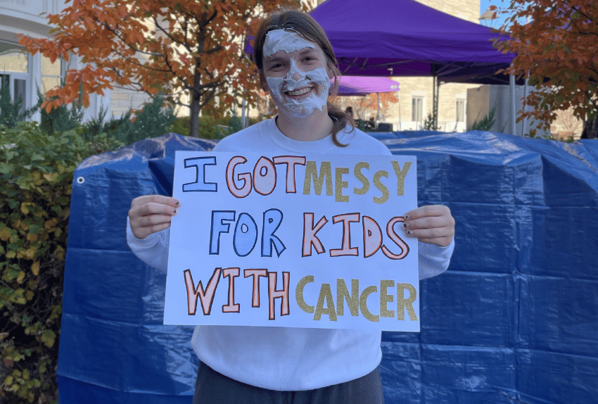 A St. Thomas student holding a sign that said 
