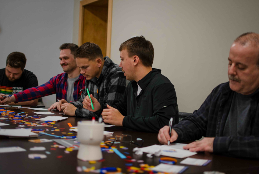 volunteers making cards for kids with cancer.