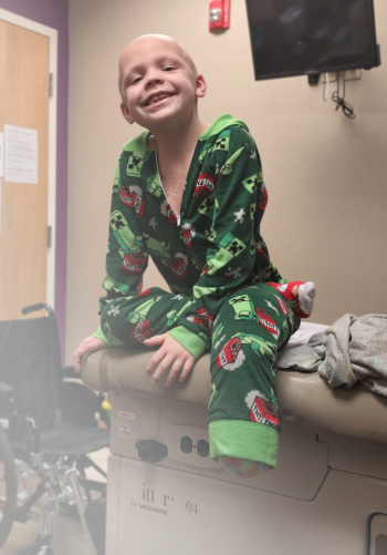 All-Star Wilson sitting on a clinic exam table