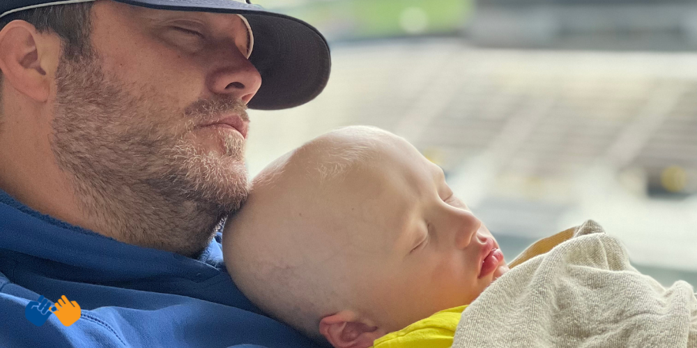 All-Star Beau sleeping with Kinnick Stadium behind them