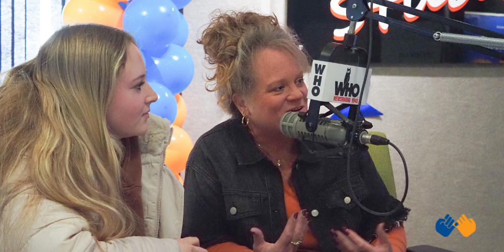 A mom and daughter talking on air at Radiothon in 2024 to raise money for kids with cancer and their families.