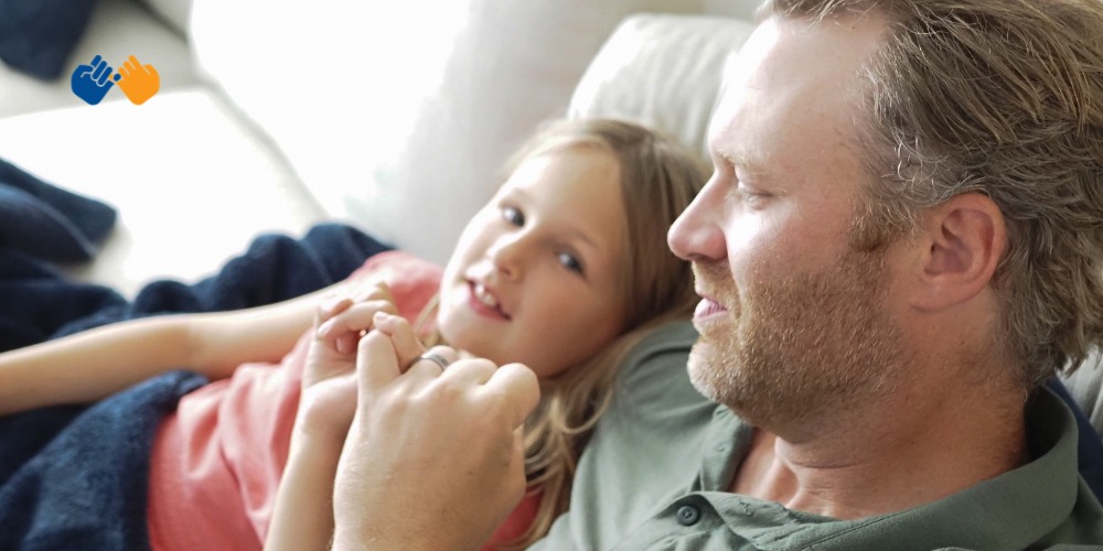 A father and a daughter doing a pinky swear