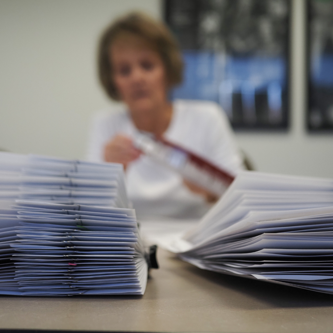 A pile of financial payments being mailed to families facing childhood cancer